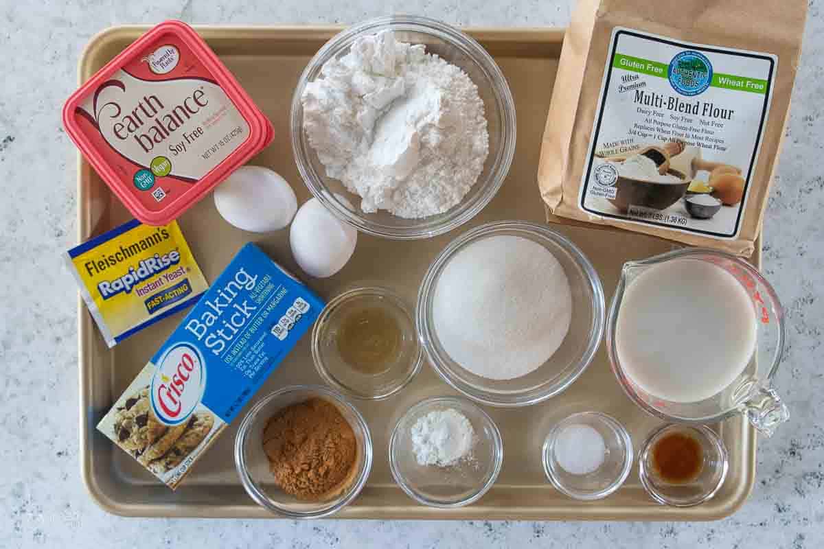 ingredients for gluten free cinnamon rolls on a sheet pan