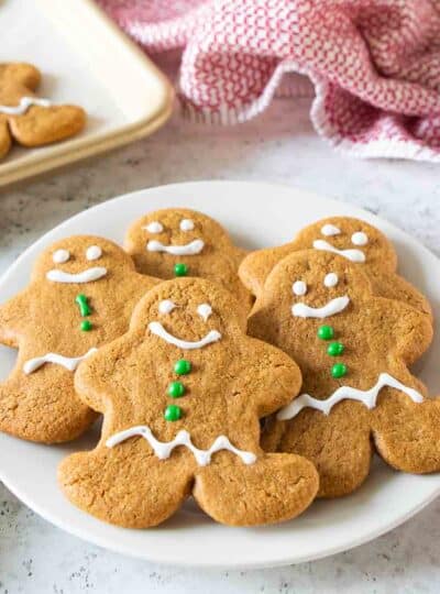 iced gingerbread cookies stacked on plate