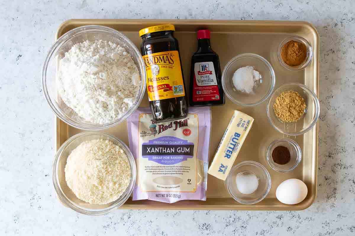 ingredients for gluten free gingerbread cookies on sheet pan