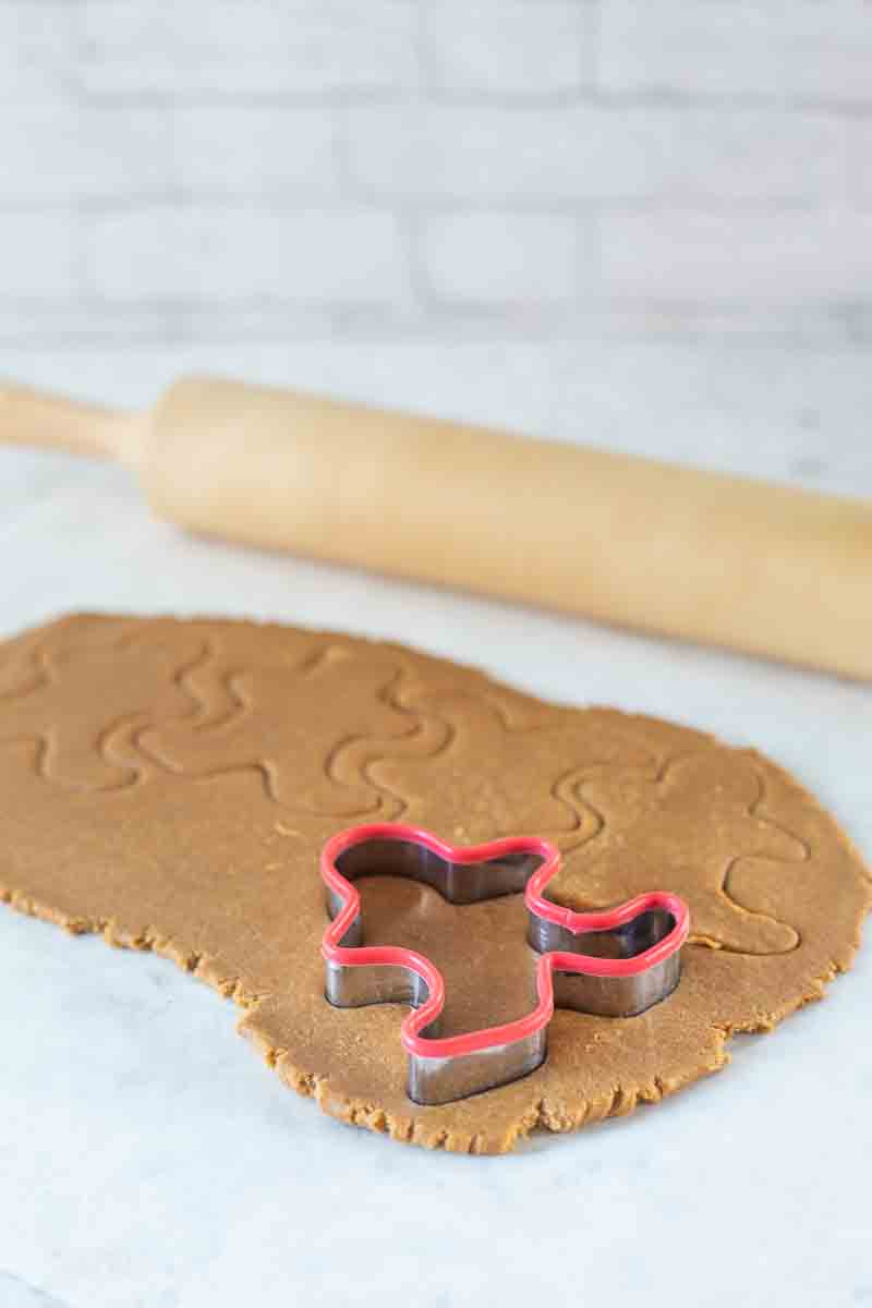 cookie cutter pressed into gingerbread cookie dough