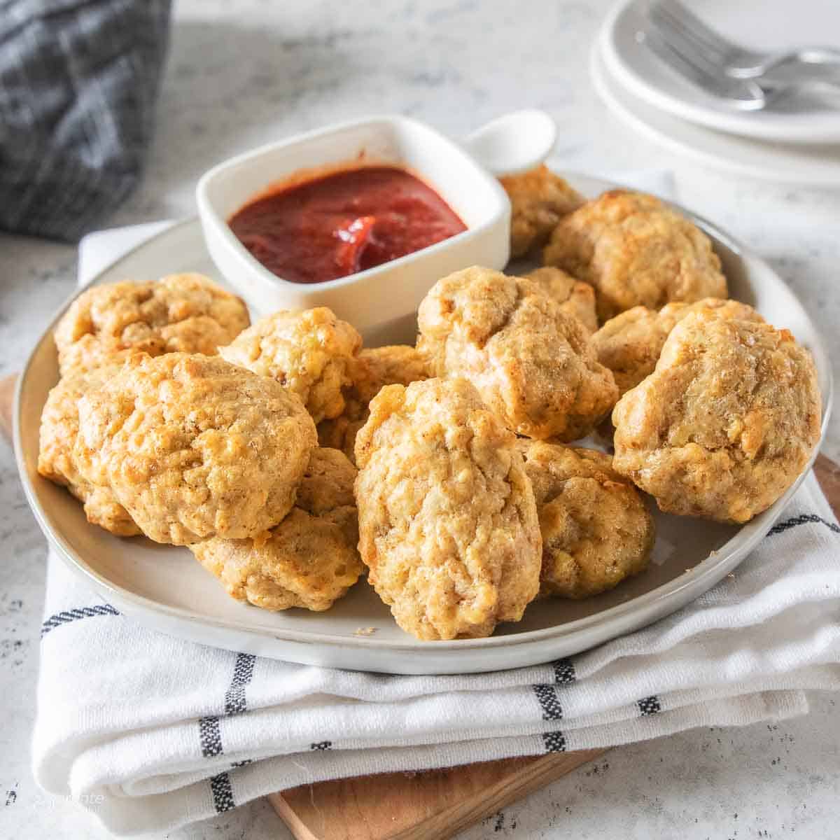 gluten free chicken nuggets next to dipping sauce