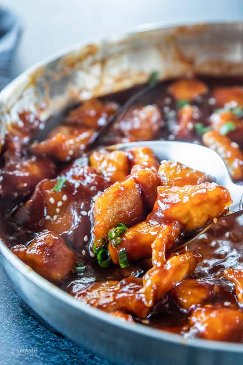 sesame chicken scooped from bowl