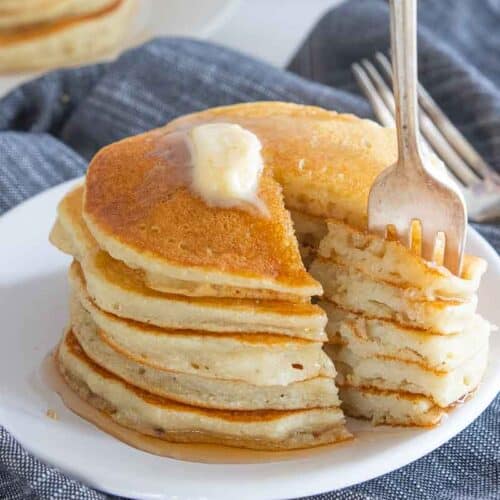fork scooping up bite from gf pancake stack