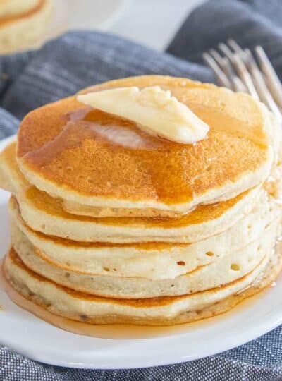 butter and syrup on top of gluten free pancakes