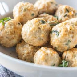 chicken meatballs garnished with fresh basil in serving bowl