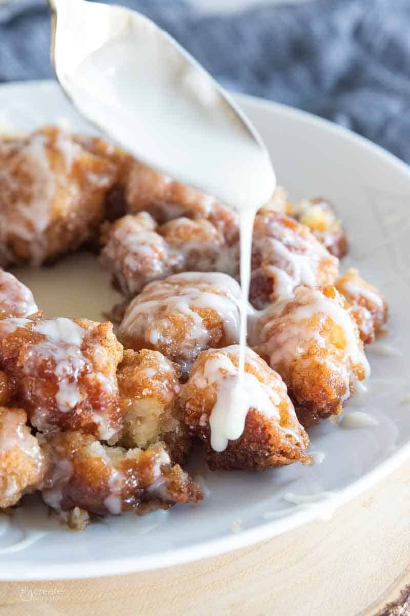 Gluten free icing being drizzled on monkey bread.