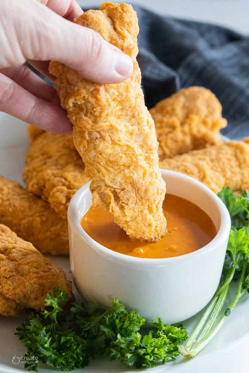 chicken tender dipped in gluten free sauce