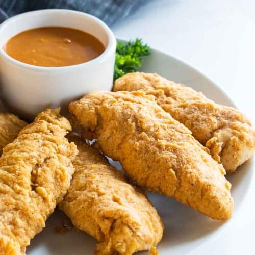 gf chicken strips on plate with sauce