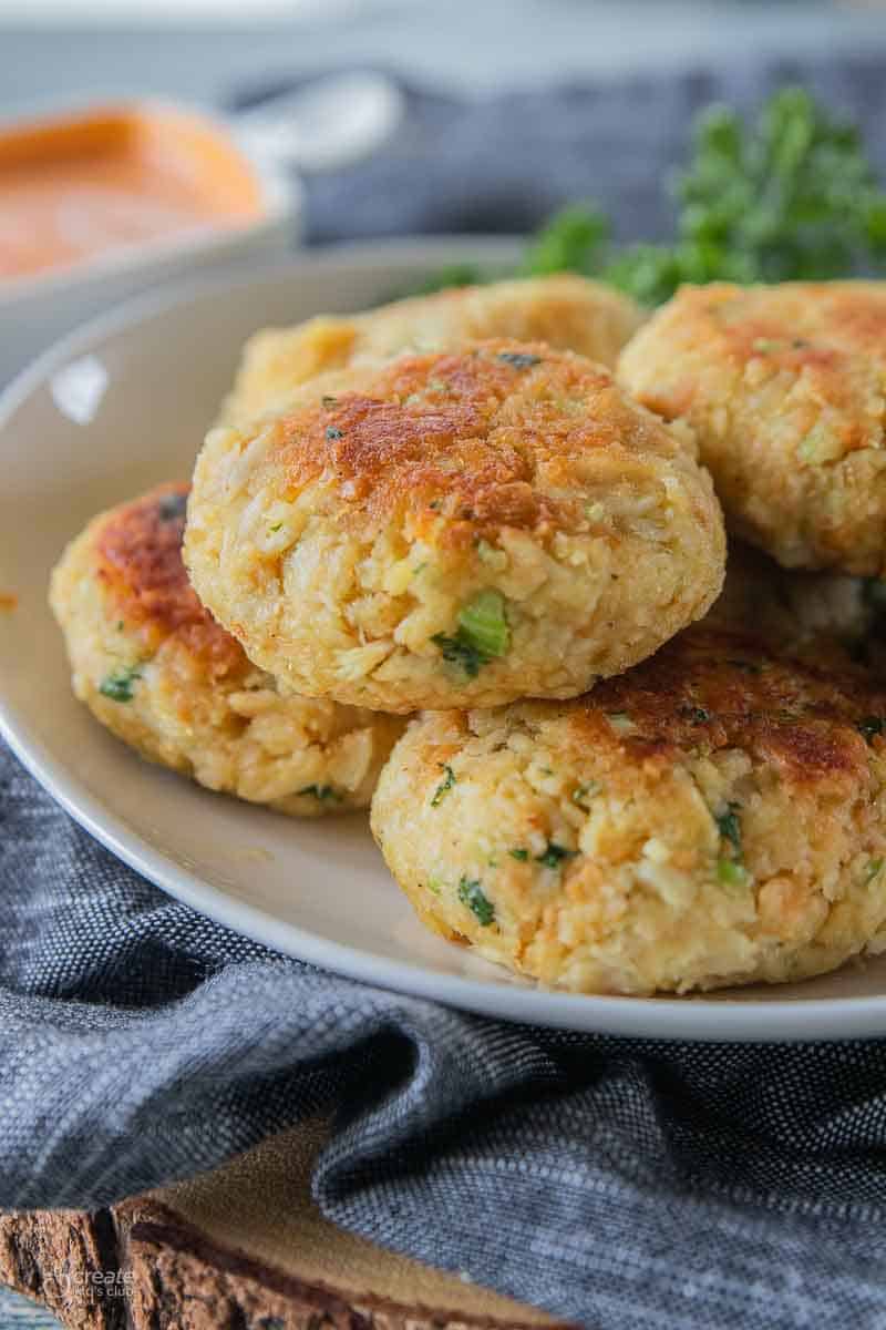 crab cakes stacked on a plate