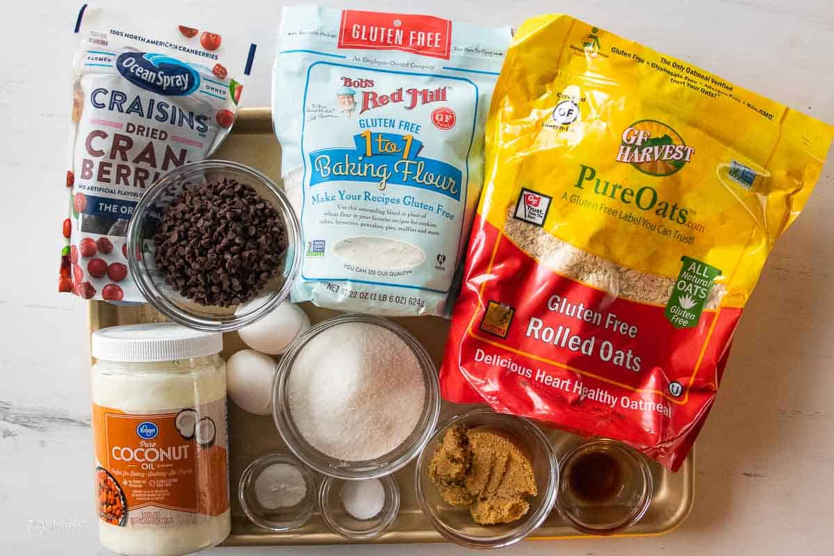 ingredients for gluten free cranberry oatmeal cookies on baking sheet