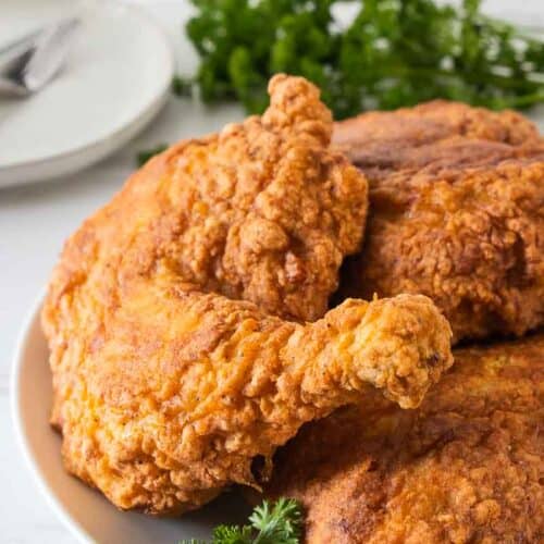 gluten free fried chicken stacked on plate
