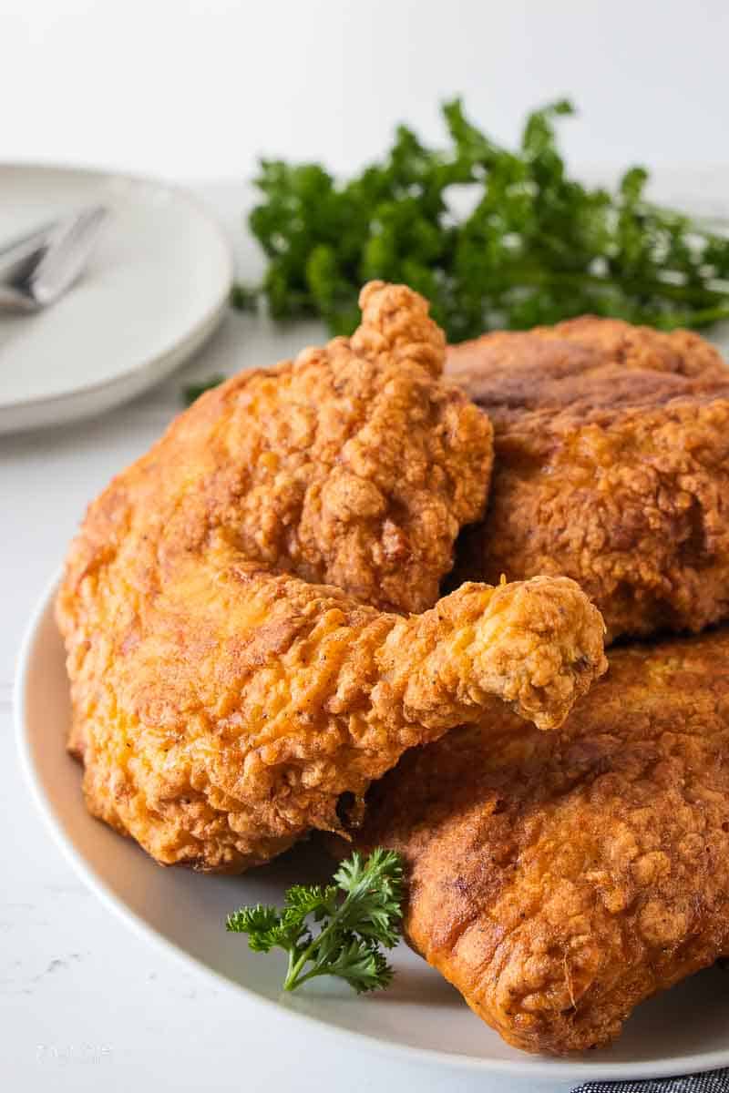 gluten free fried chicken stacked on plate