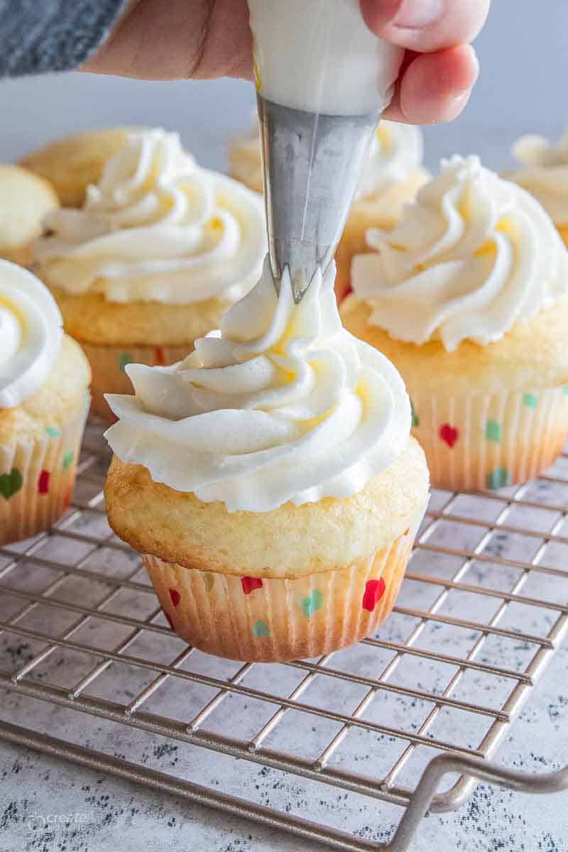 white frosting piped onto gluten free frosting