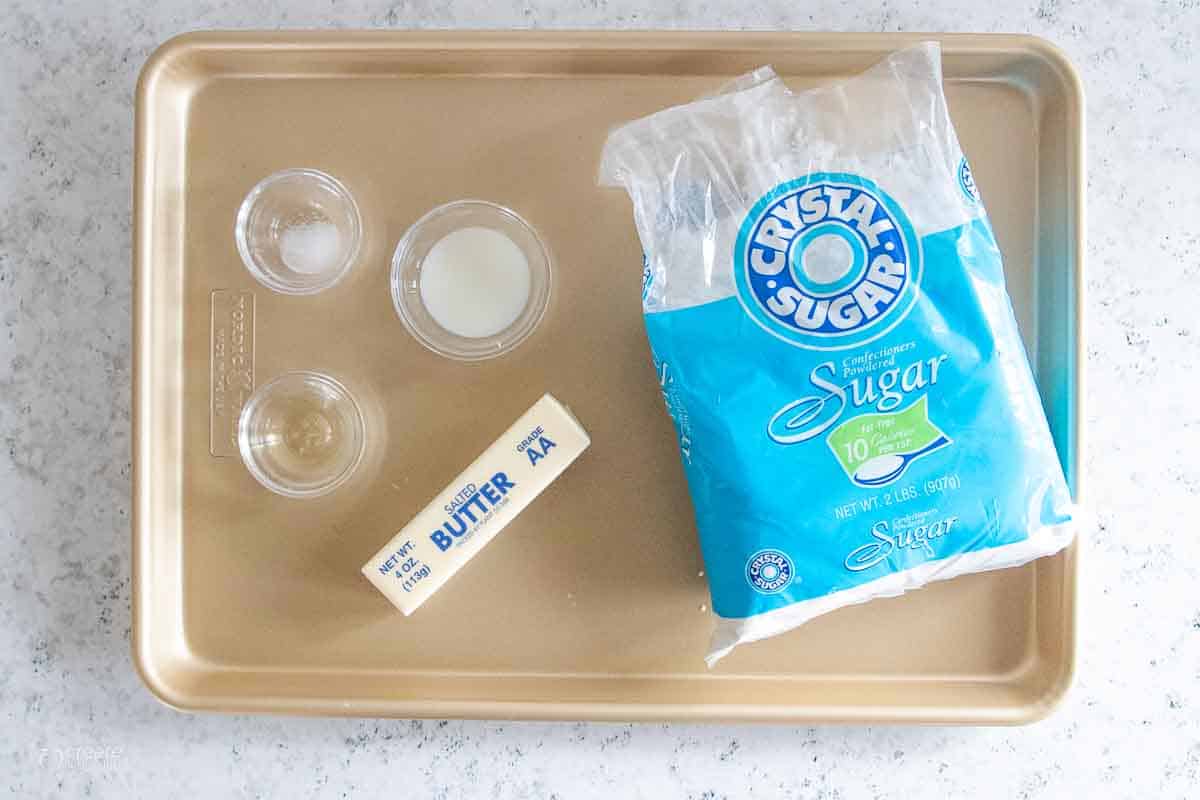 powdered sugar, butter, salt, oil and soy milk on sheet pan