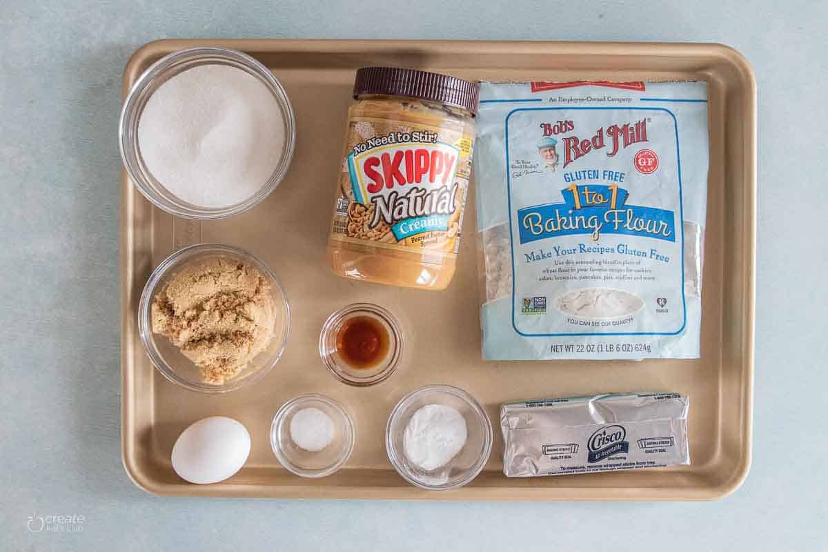 ingredients for gluten free peanut butter cookies on a baking sheet
