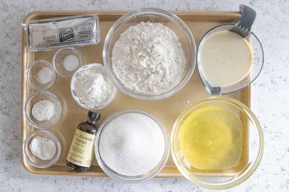 ingredients for gluten free vanilla cupcakes on sheet pan