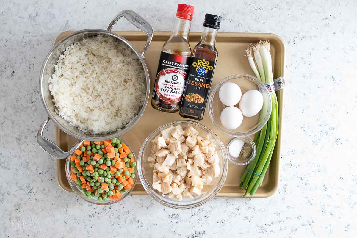ingredients for gluten free chicken fried rice on baking sheet