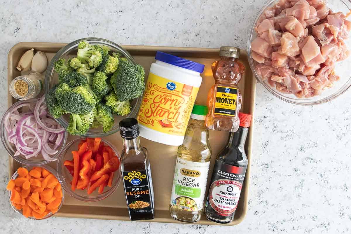 ingredients for gluten free chicken stir fry on baking sheet