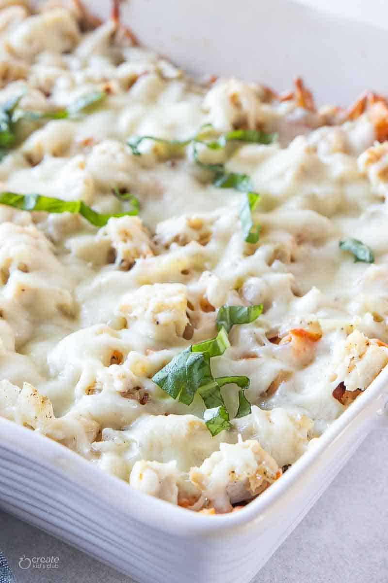 close up view of chicken ziti in baking dish