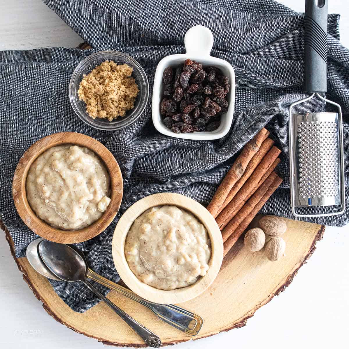 rice pudding on display next to bowl of raisins and brown sugar