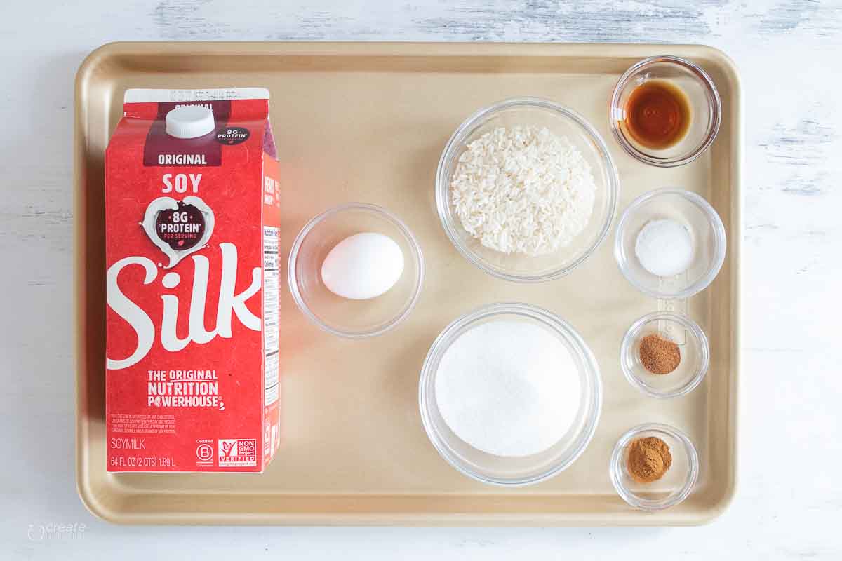 soy milk, egg, spices, sugar and white rice on baking sheet