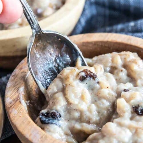 dairy free rice pudding in bowl with spoon