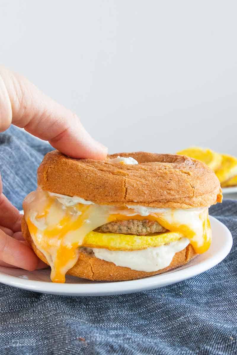 hand holding gf breakfast sandwich