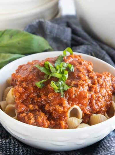 gf pasta sauce poured on top of gluten-free pasta