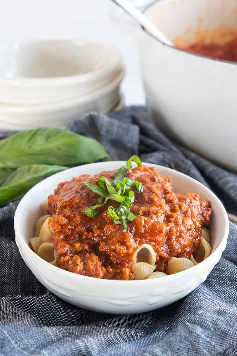 gf pasta sauce poured on top of gluten-free pasta