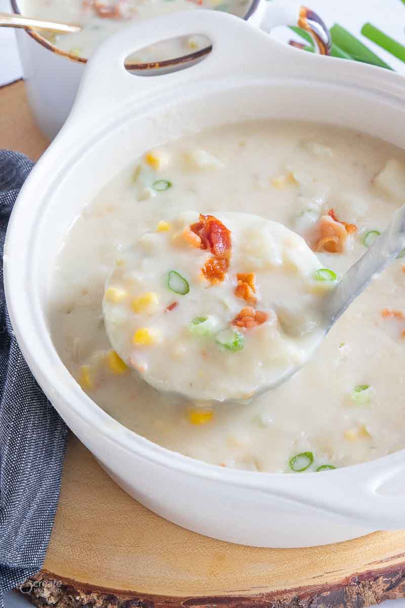 ladle scooping serving of gluten free potato soup