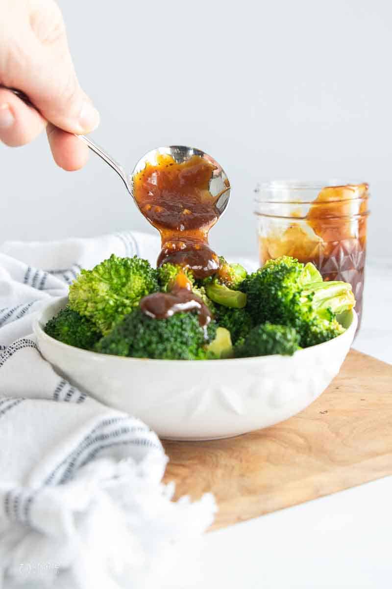 stir fry sauce drizzled over steamed broccoli