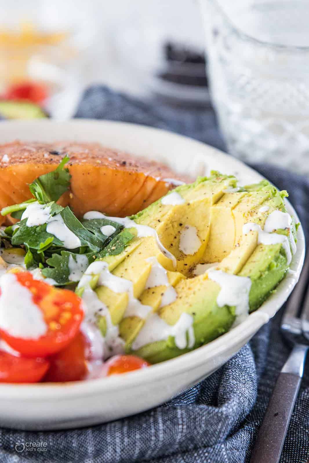 ranch drizzled over salmon buddha bowl