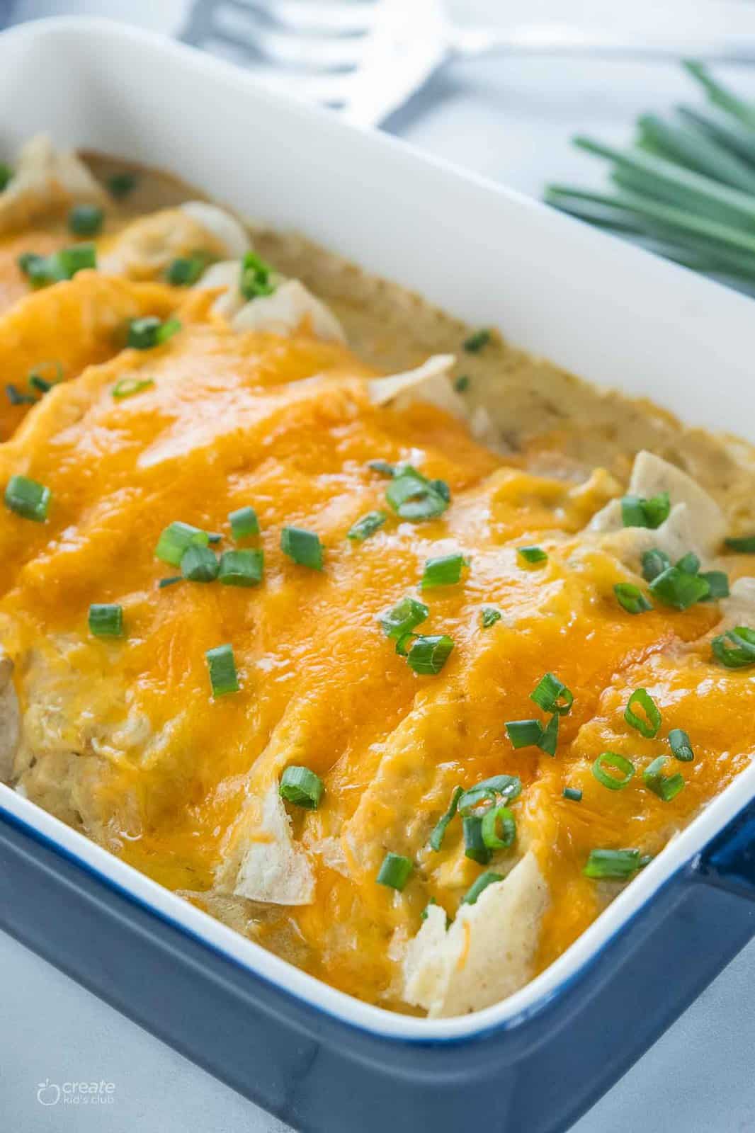 baked gf chicken enchiladas in baking dish