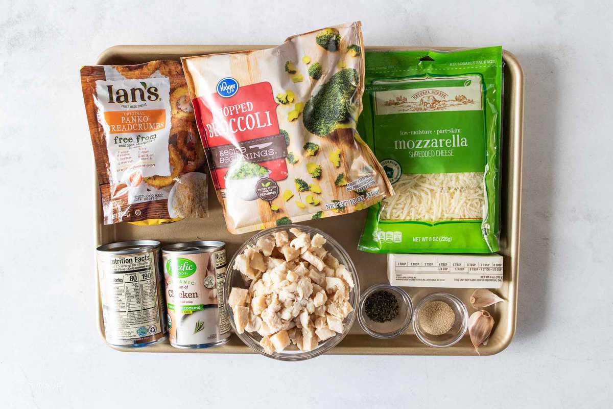 Ingredients for chicken casserole on a baking tray.