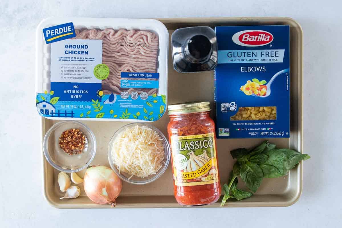 ingredients for ground chicken parmesan pasta on sheet pan