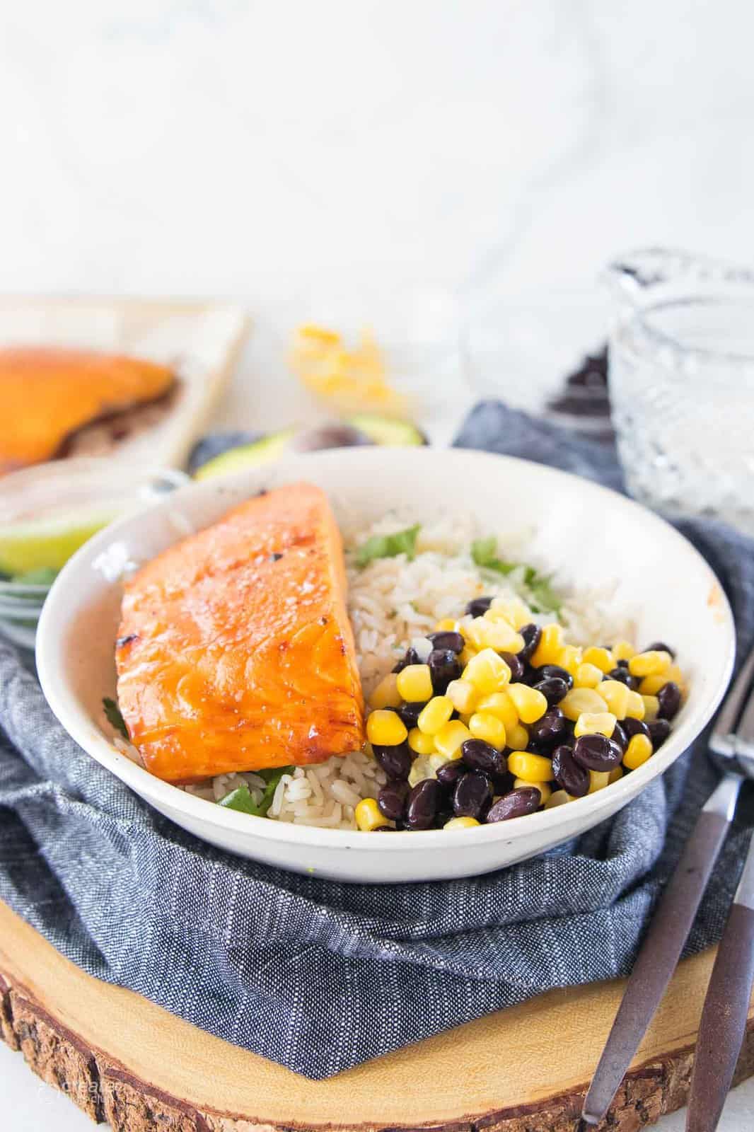 buddha bowl with salmon filet, cilantro rice, corn and black bean salsa