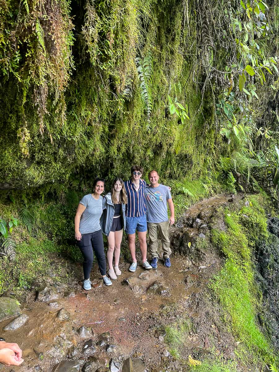 Family by water fall in Costa Rica.