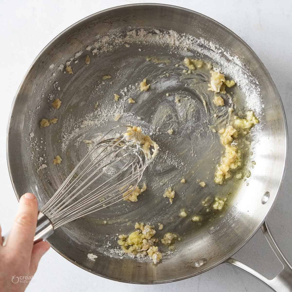 garlic and flour whisked in pan