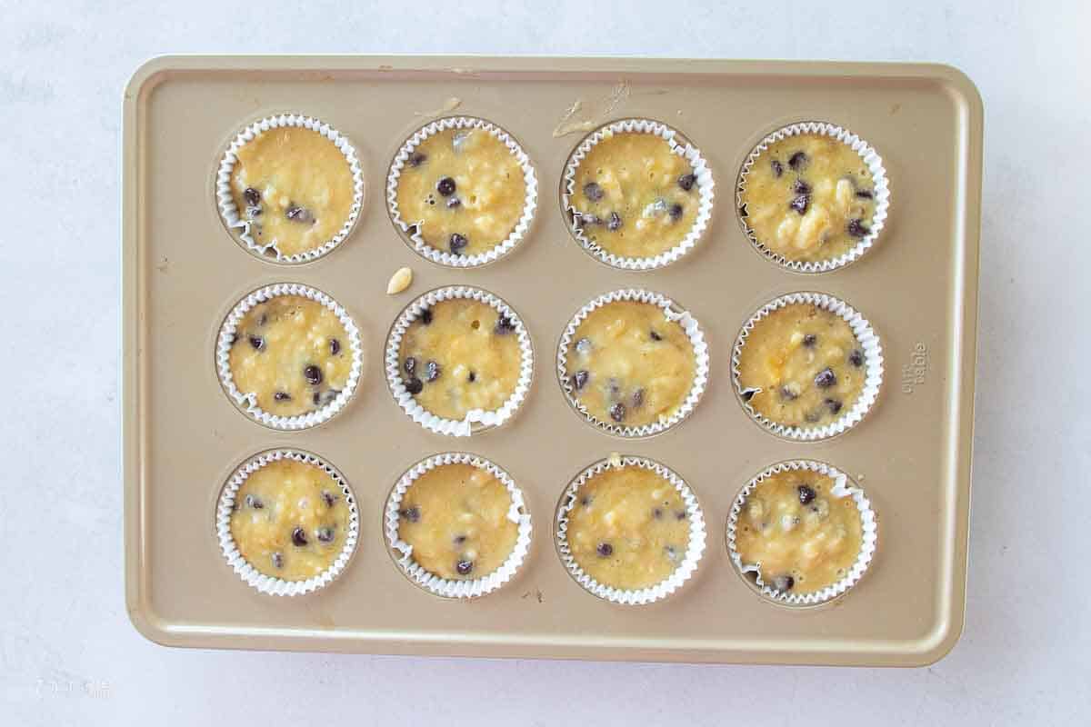 banana chocolate chip muffin batter in muffin liners