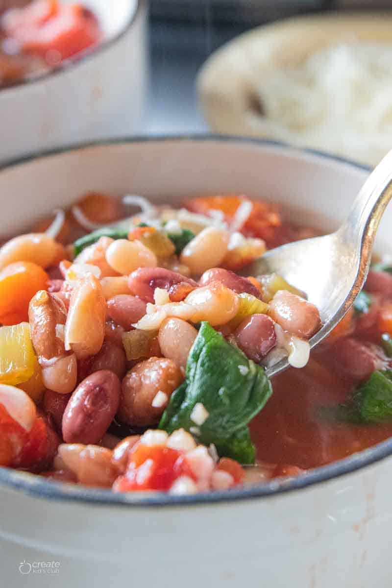 spoon ladling soup from bowl