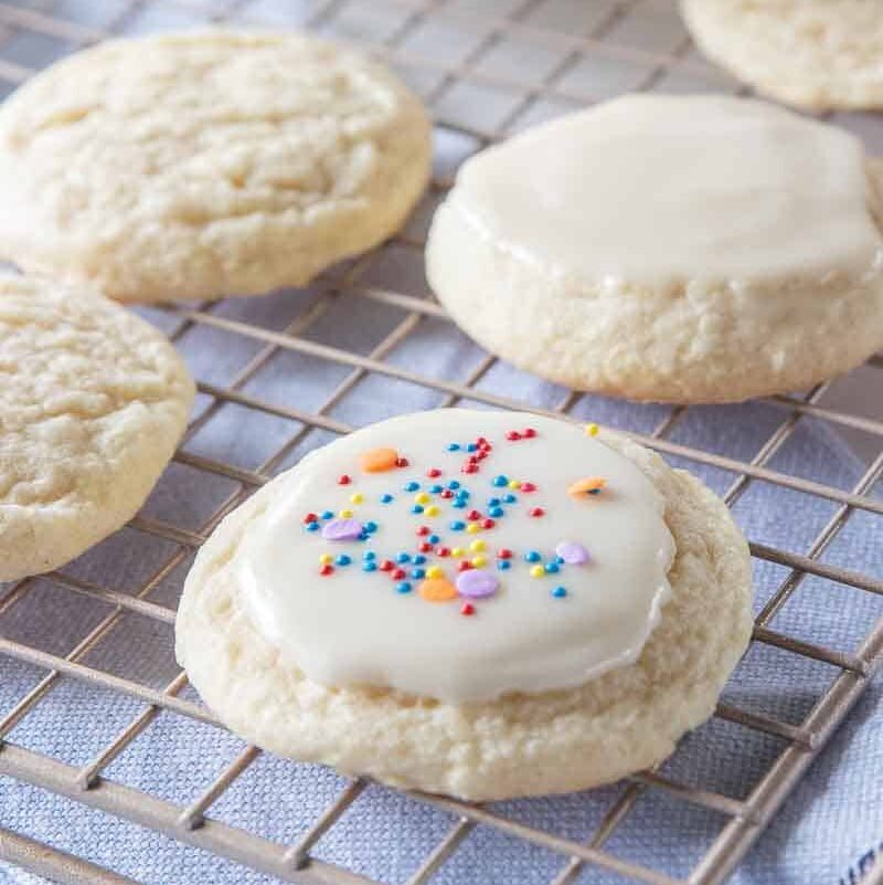 sugar cookie topped with icing and sprinkles