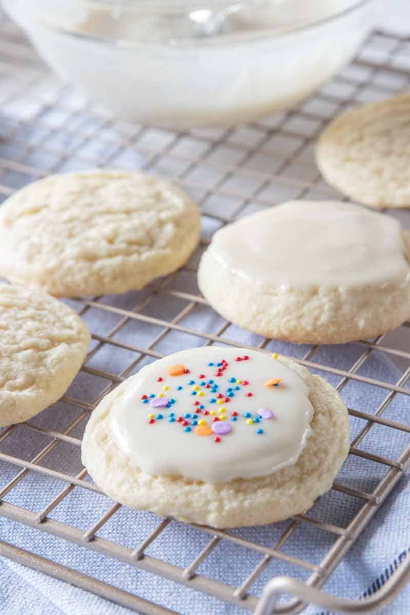 sugar cookie topped with icing and sprinkles