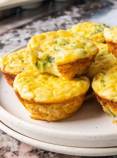 Mashed potato bites stacked on a plate.