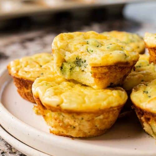 Mashed potato bites stacked on a plate.