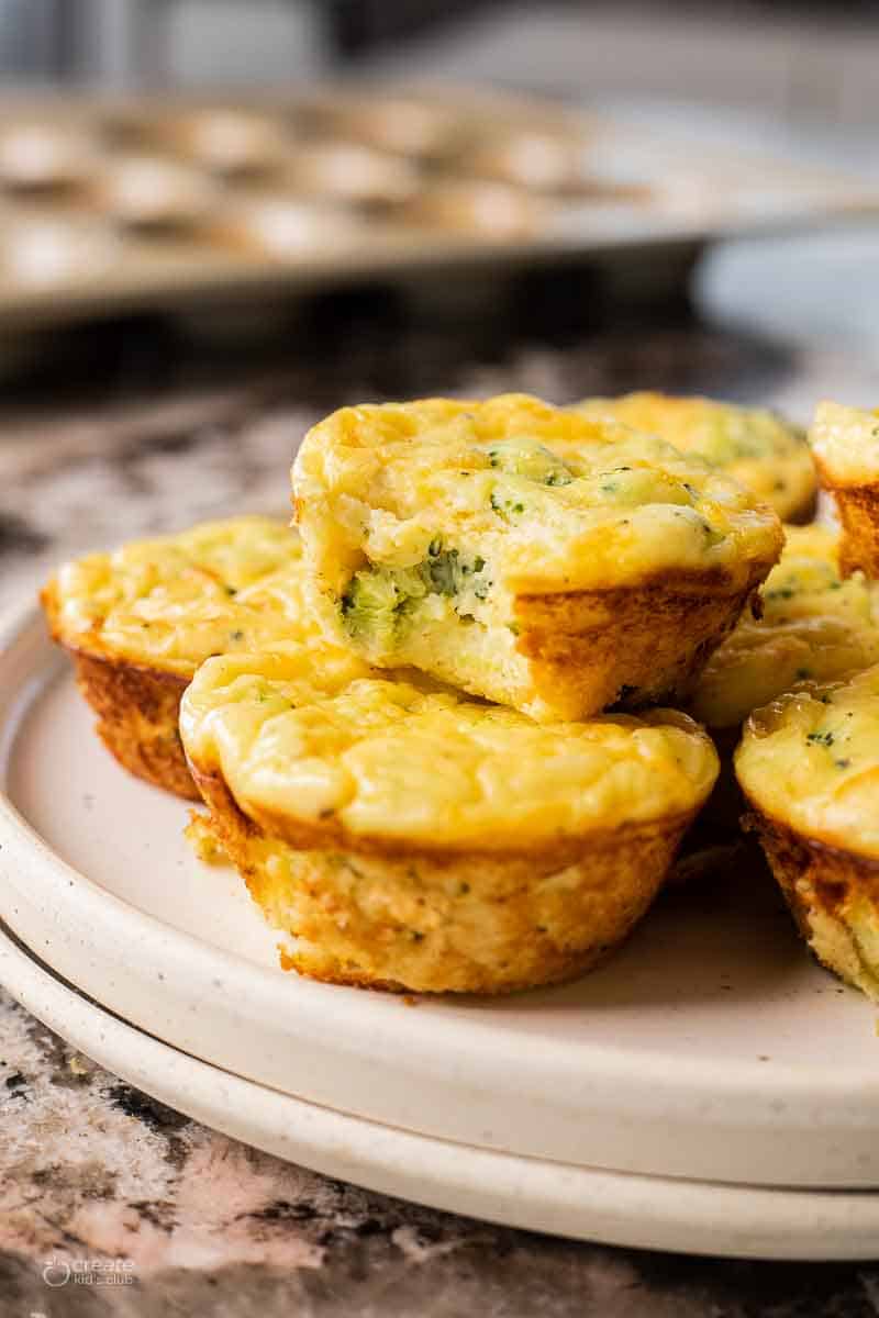 Mashed potato bites stacked on a plate.