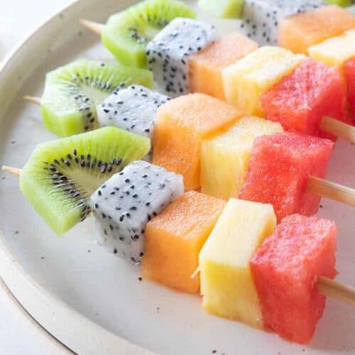 fruit skewers on plate