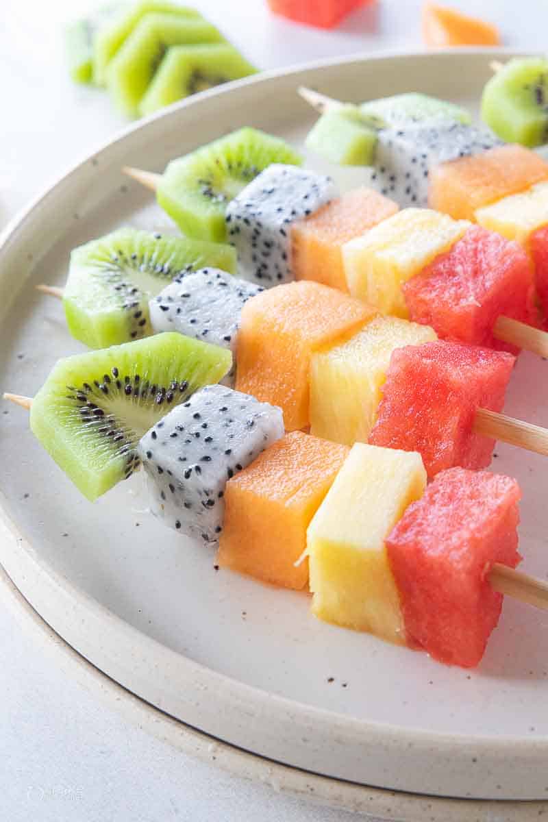 fruit skewers on plate