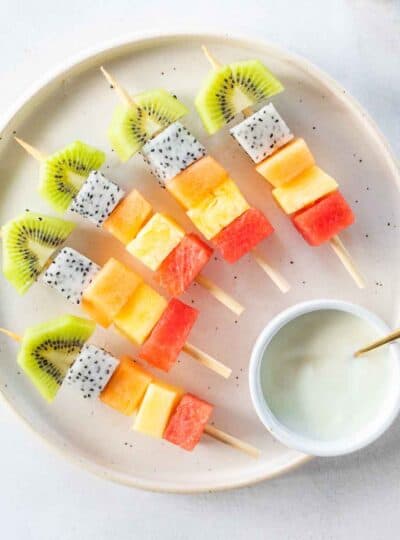 fruit skewers on plate with dipping sauce