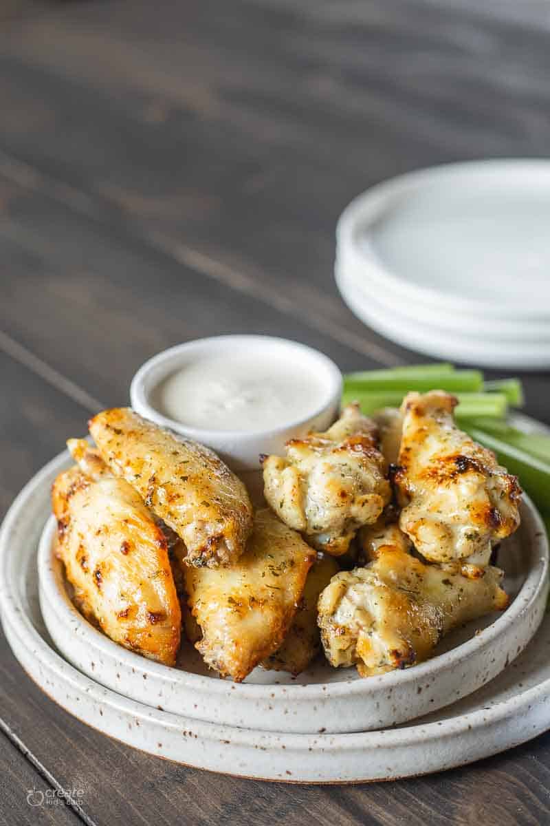 air fryer chicken wings stacked on plate