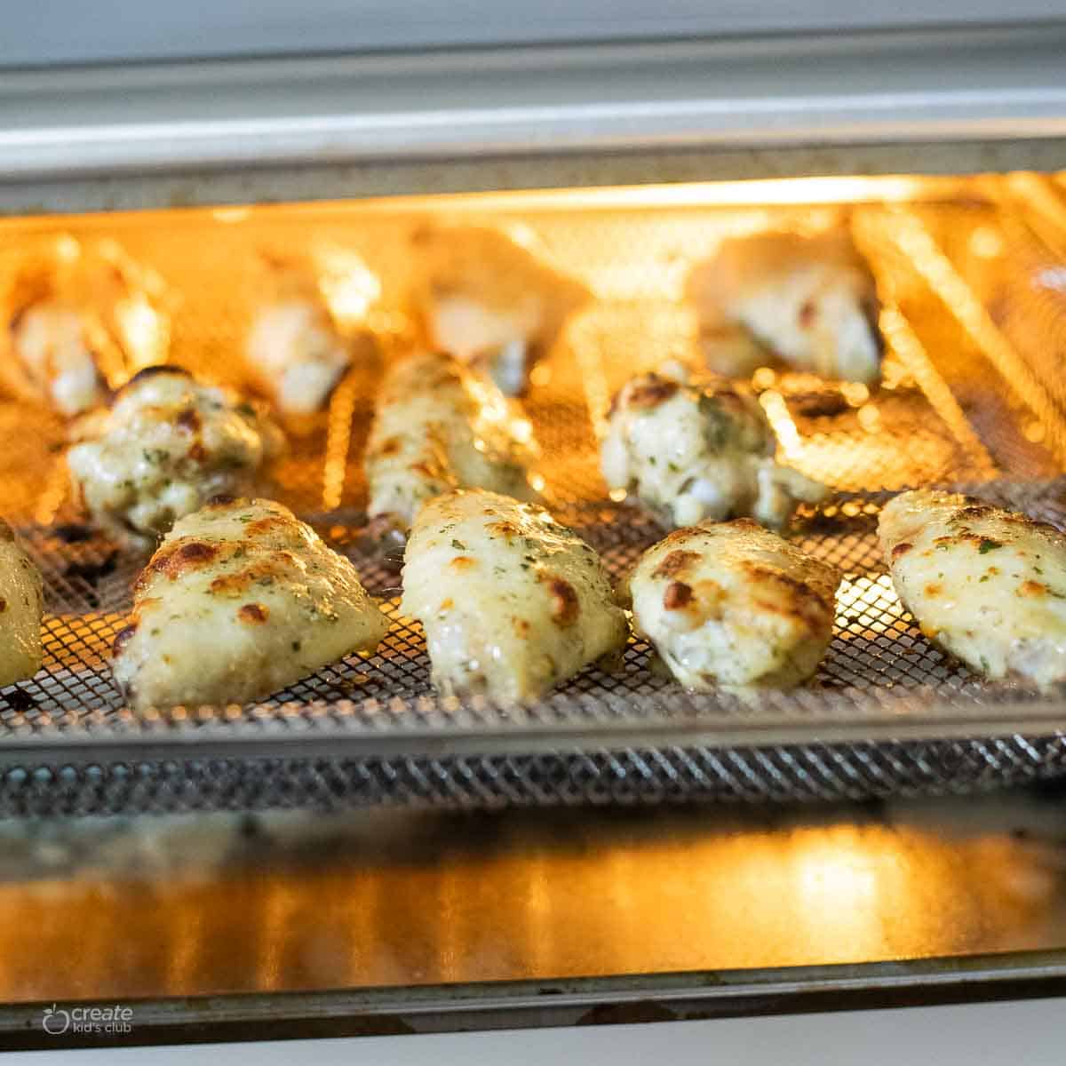 cooked chicken wings removed from air fryer